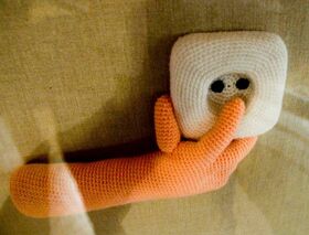 I m not sure why they had a knitted hand putting i.jpg