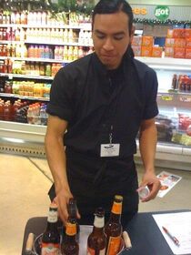 Guy serving beer at HEB.jpg