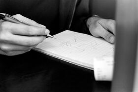 Tristan drawing up plans for the project.jpg
