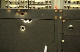 WISC Computer with bullet holes.jpg